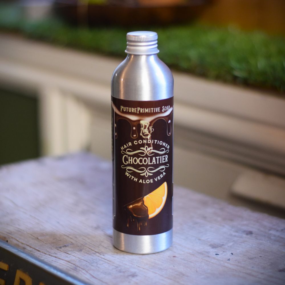 Aluminum bottle with a label on a wooden surface