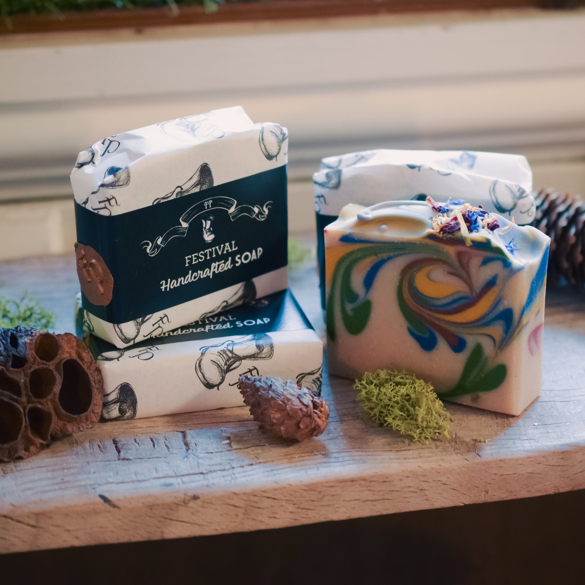 Handcrafted soap with decorative packaging on a wooden surface