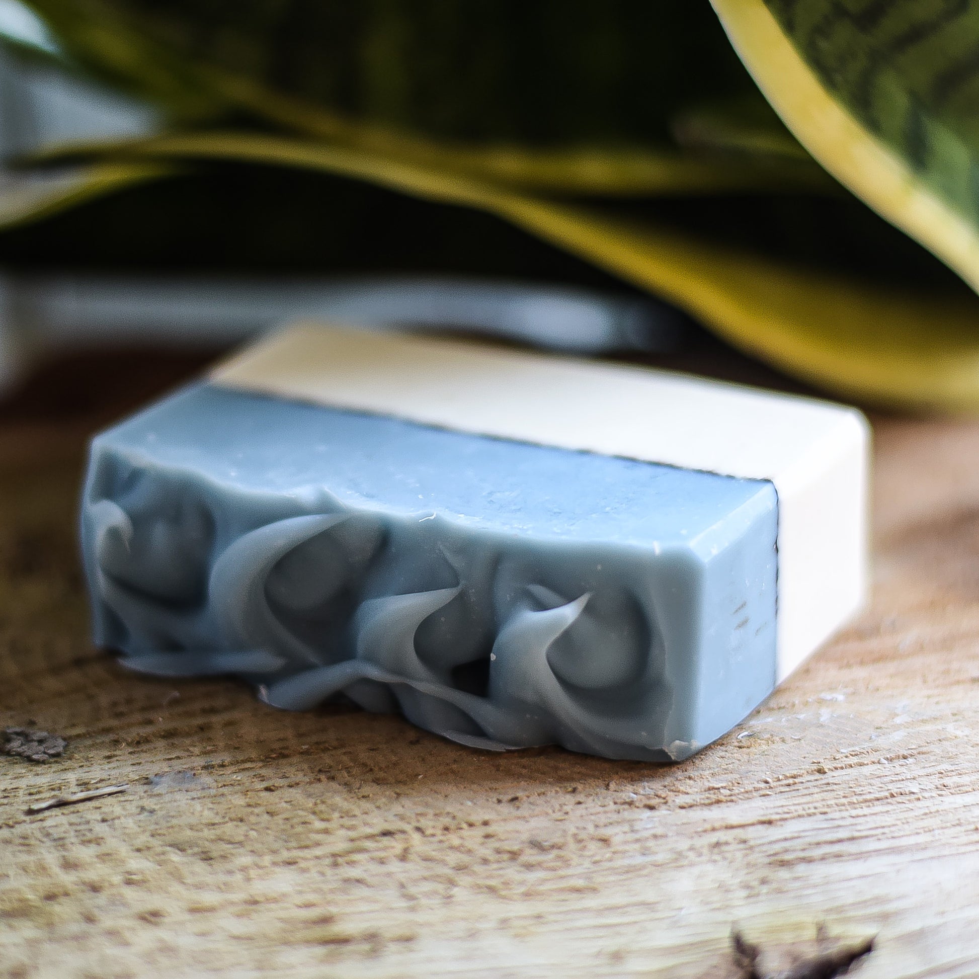 Bar of handmade artisan soap with on a wooden surface