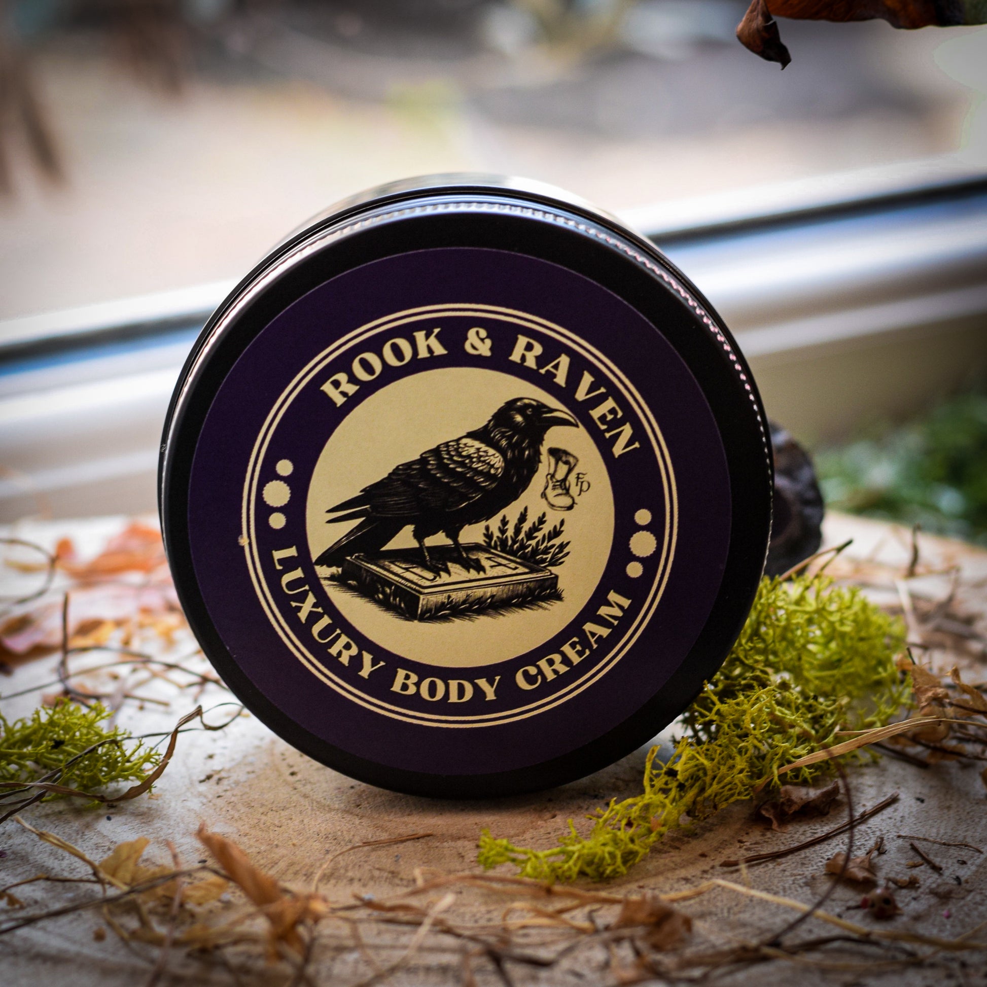 Rook & Raven Luxury Body Cream container on a natural background