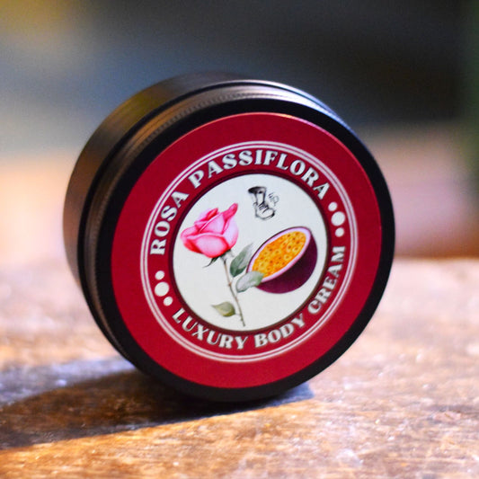 Rosa Passiflora luxury body cream jar on a wooden surface