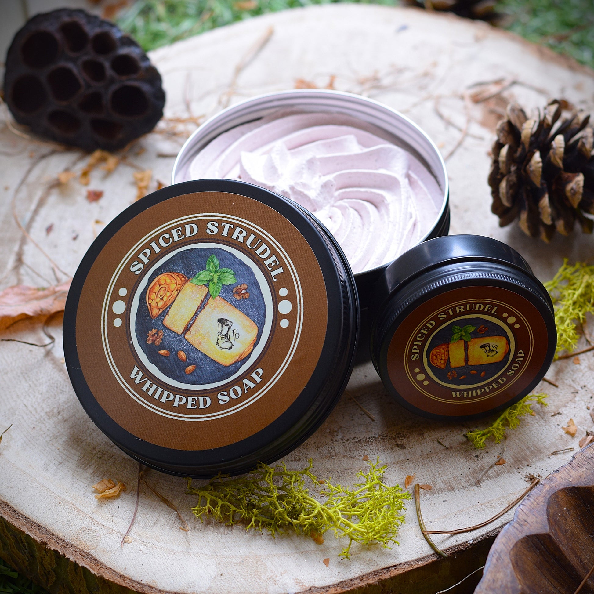 Spiced Strudel whipped soap surrounded by seed pods and pine cones