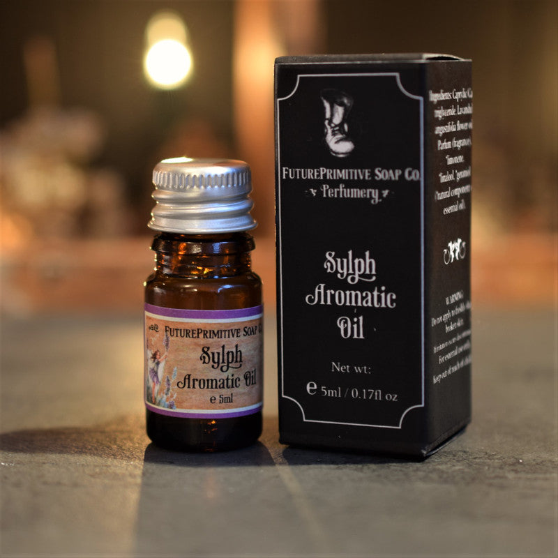Sylph Aromatic Oil bottle and packaging on a blurred background