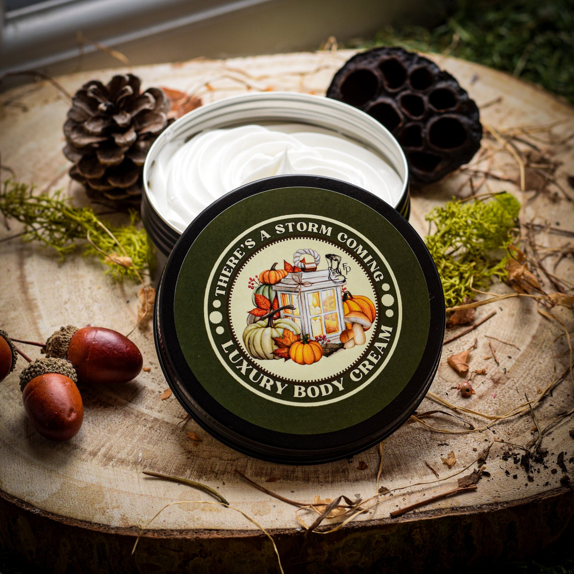 There's a Storm Coming sitting on a wooden table surrounded by moss and seed pods