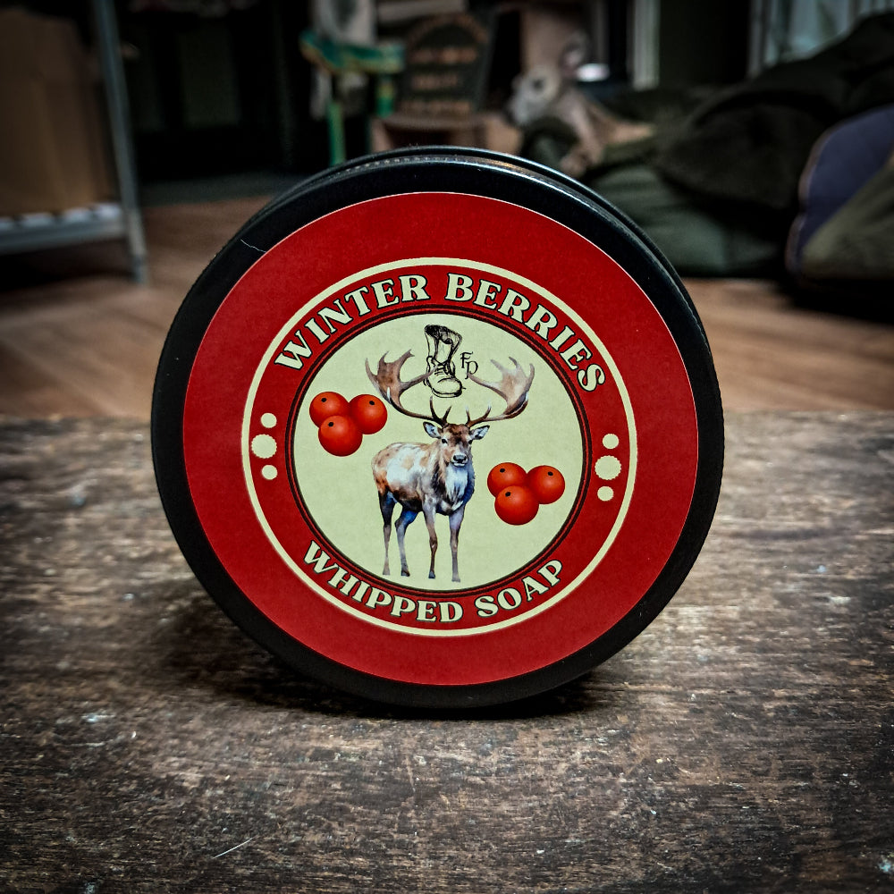Winter Berries Whipped Soap tin on a dark wooden surface