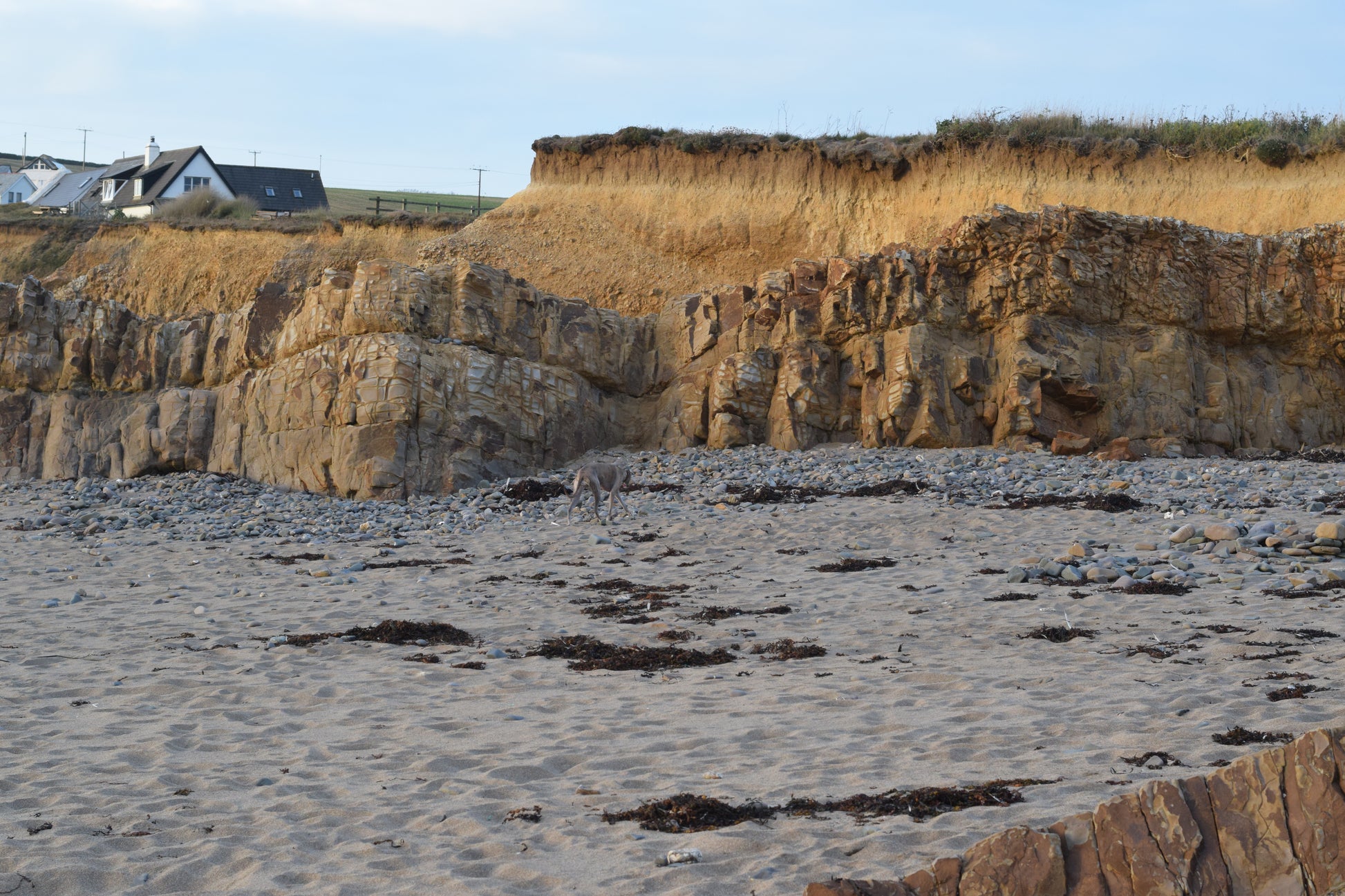 Cliffside with houses and a clear sky
