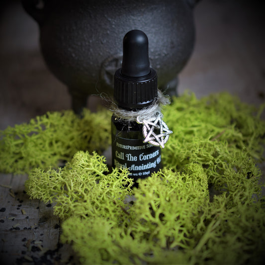 Black bottle with dropper on green moss with a blurred background