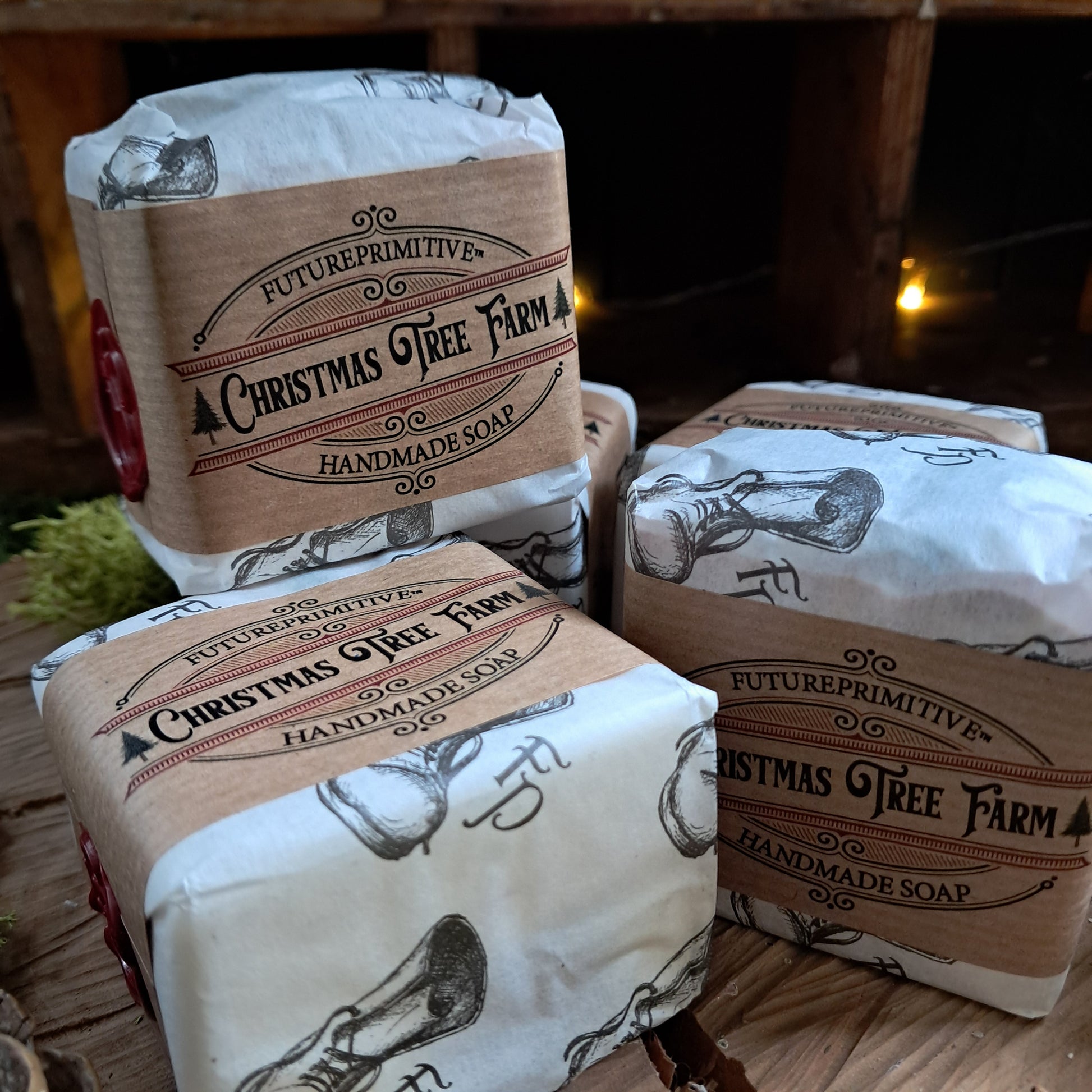 Handmade soap bars from Christmas Tree Farm on a wooden surface with a rustic background.