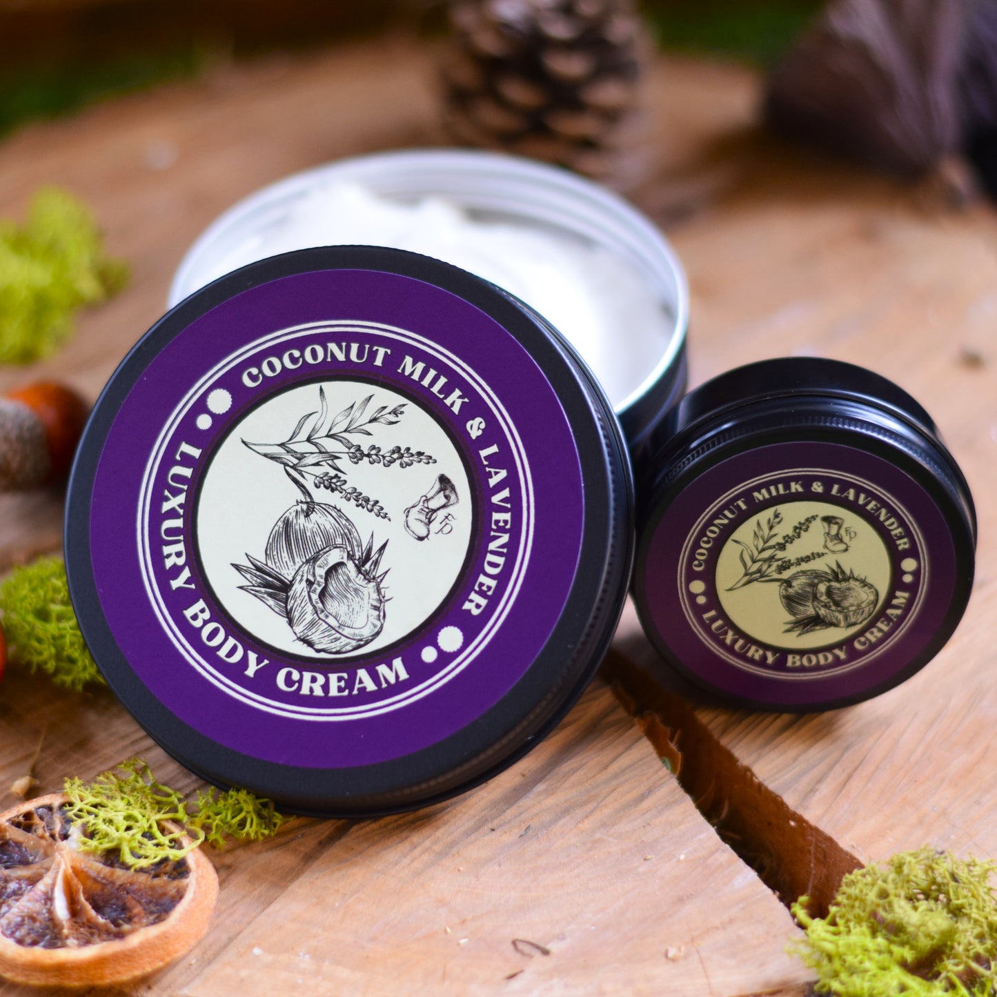 coconut milk & lavender luxury body cream on a wooden table surrounded by natural elements