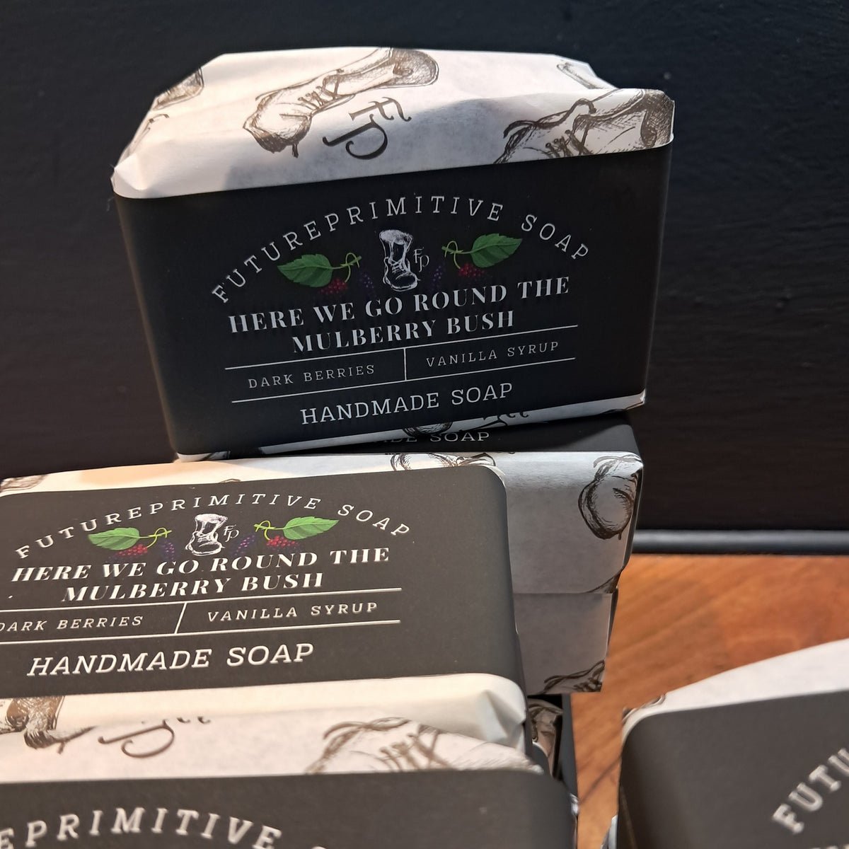 packets of handmade soap with futureprimitive soap branding and the name 'Here We Go Round The Mulberry Bush' on the front. 