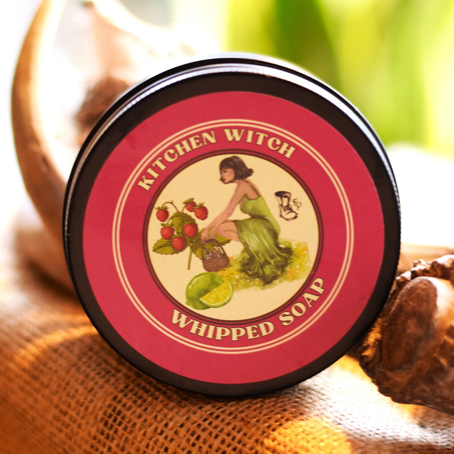 Kitchen Witch whipped soap container with a vintage-style label on a textured surface.