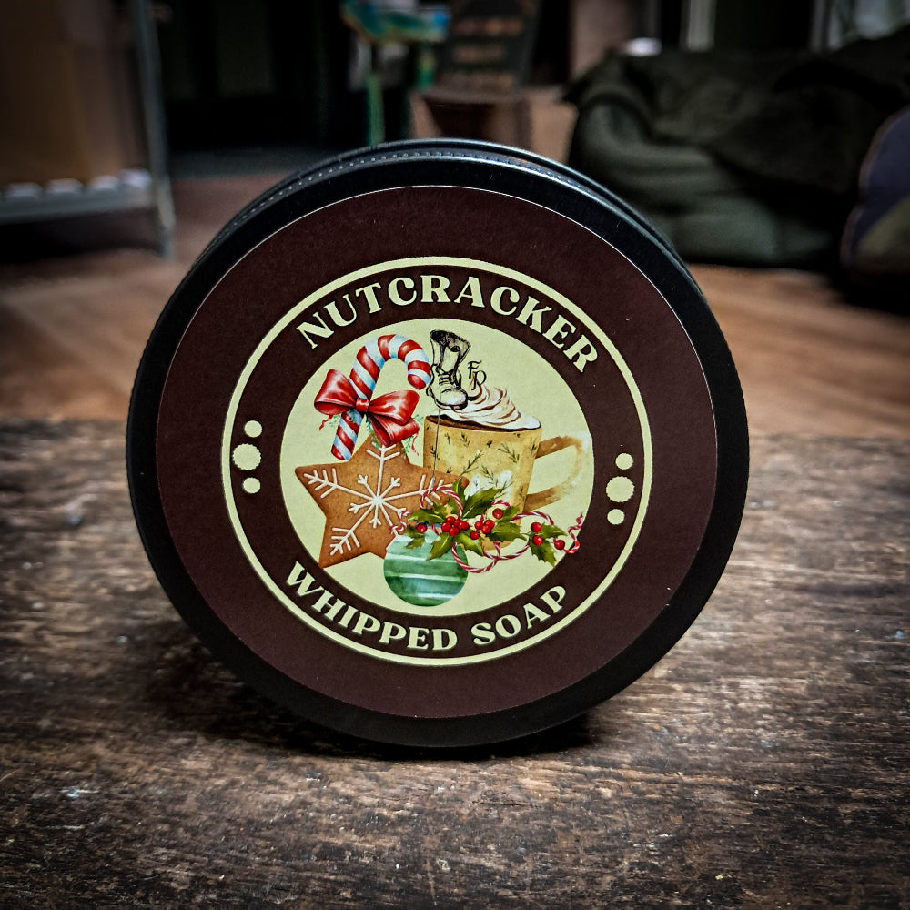 Nutcracker Whipped Soap on a dark wooden surface