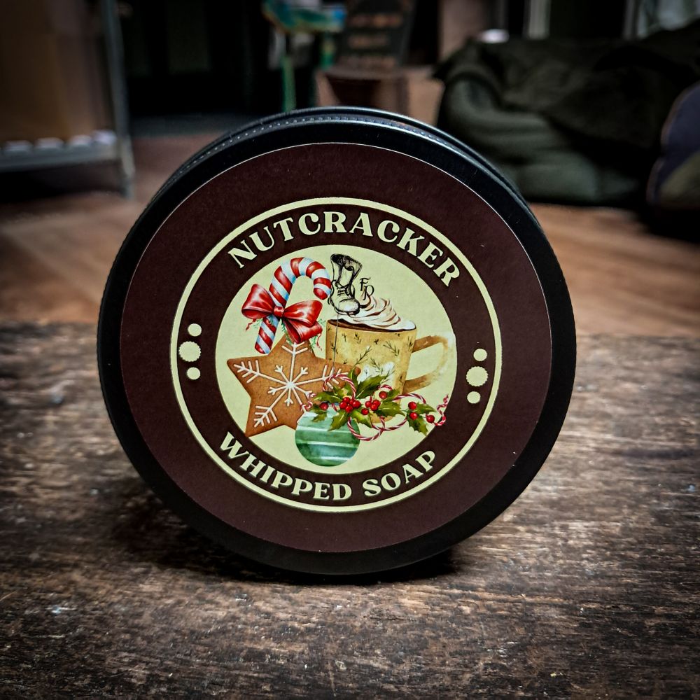 nutcracker whipped soap in a black tin with fancy brown label.