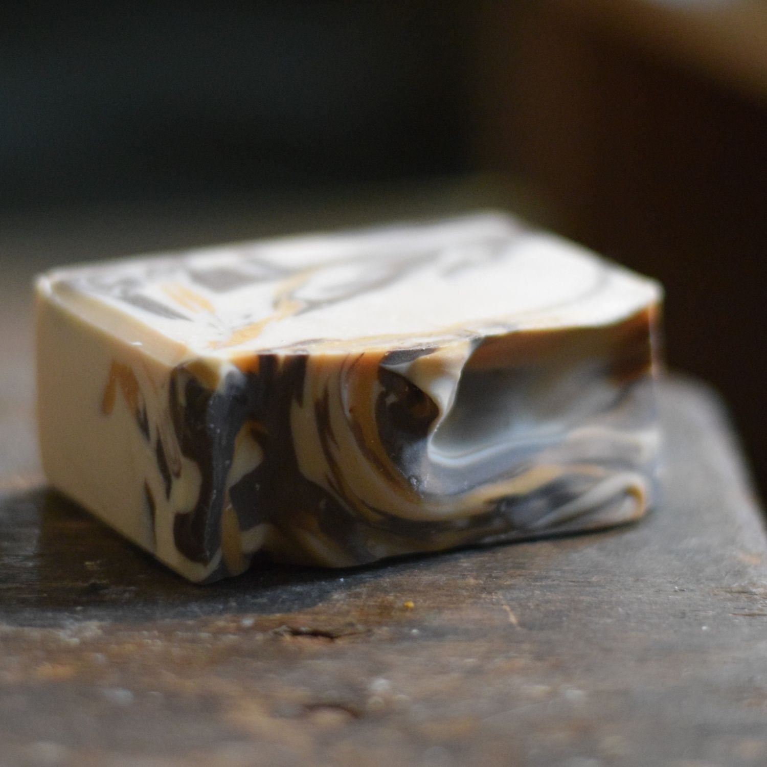 Marbled soap bar on a dark surface