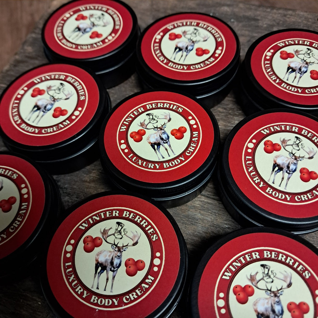 9 small tins of winter berries body cream