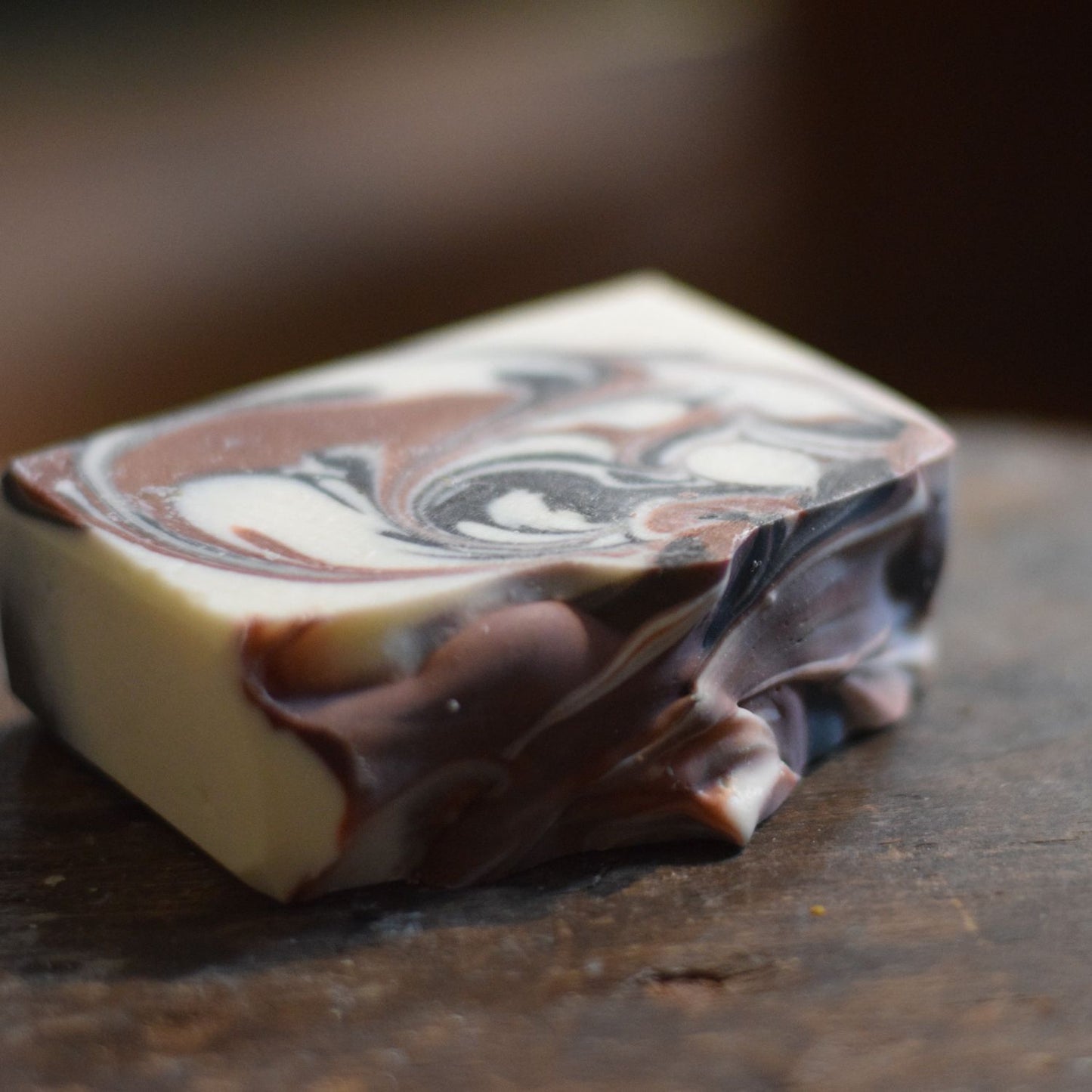Marbled soap bar on a dark surface